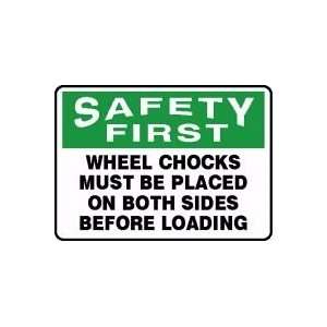 SAFETY FIRST WHEEL CHOCKS MUST BE PLACED ON BOTH SIDES BEFORE LOADING 