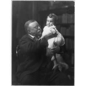: President Roosevelt,Theodore,holding,infant grandchild,seated,books 