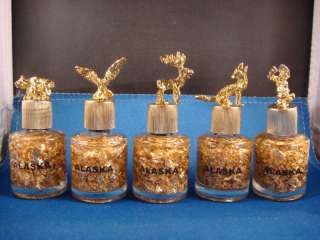 gold flakes in bottle pounded, animals on top real gold  