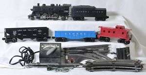 Lionel 1060 loco and tender, 6042, 6076, caboose, track  