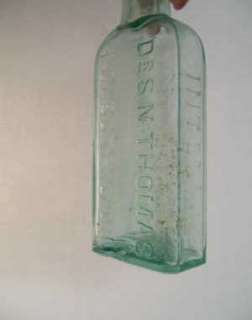 small green glass bottle dr s n thomas eclectric oil northrop lyman co 
