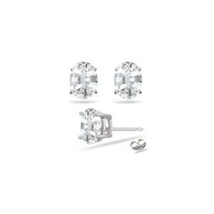 58 Cts of 7x5mm AAA Oval Natural White Sapphire Stud Earrings in 14K 