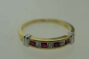 Princes cut ruby and diamond aniversary bend style ring  