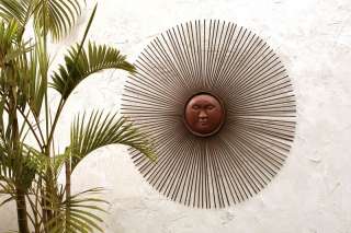 vivid take on the outdoor sun face This piece of garden art mounts 